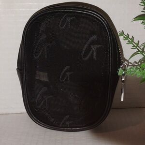 Glam-Aholic Lifestyle Monogram Mesh Wristlet. Black in color.